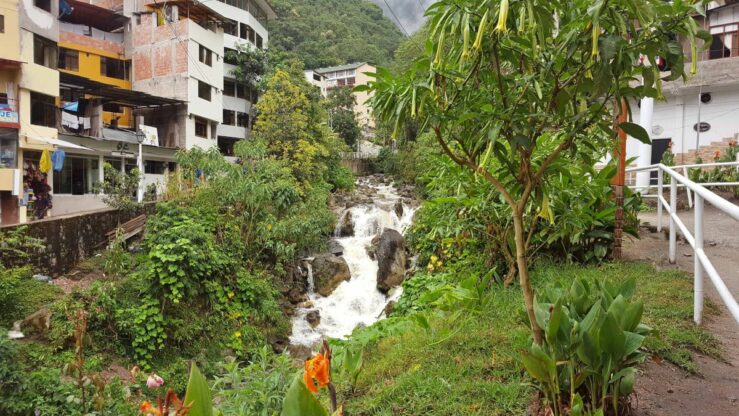 Lush riverside in Aguas Calientes. Machu Picchu Mountain - Inca culture