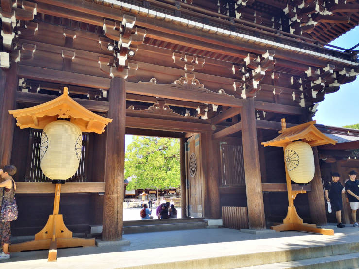 Wooden shrine gate at Meiji Jingu opening into a quiet inner courtyard Tokyo