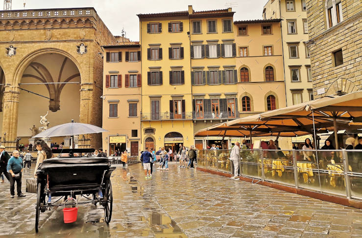 Piazza della Signoria in Florence surrounded by Renaissance sculptures and historic buildings