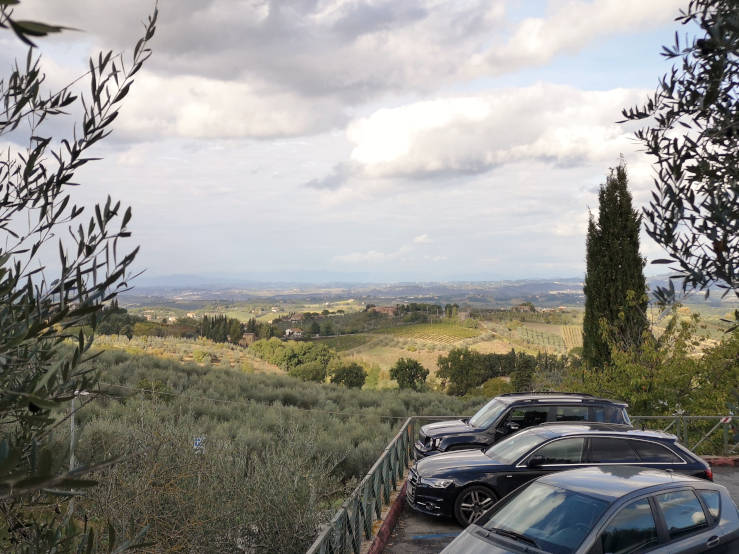 Parking area outside San Gimignano with the Tuscan countryside in the background