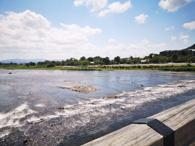 Panoramic view of the Katsura River and mountains from Togetsukyo Bridge in Arashiyama, Kyoto